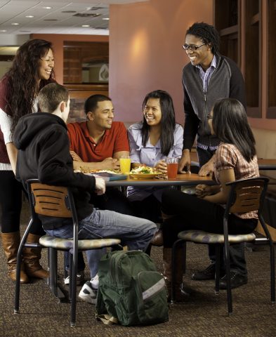 Student gathering together for a meal in Dining Services.